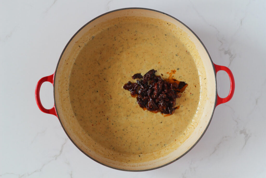 Dairy free marry me chicken sauce in pan with sun-dried tomatoes