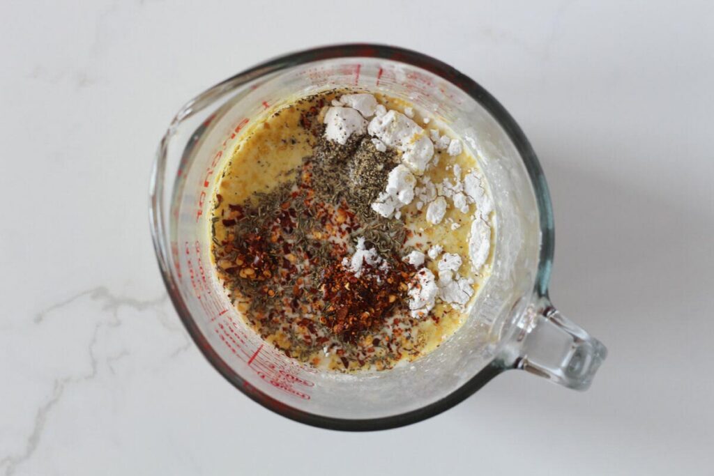Marry me chicken sauce ingredients in Pyrex measuring cup