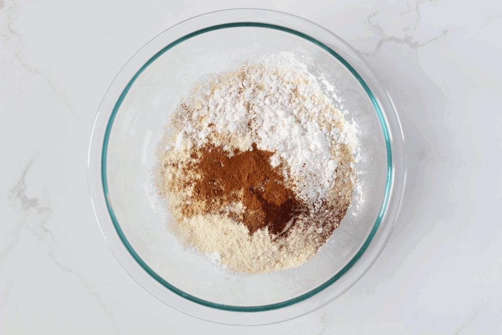 Gluten free pumpkin waffles dry ingredients in glass bowl