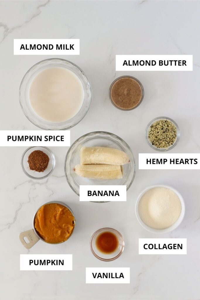 labeled pumpkin protein smoothie ingredients laid out on marble counter 