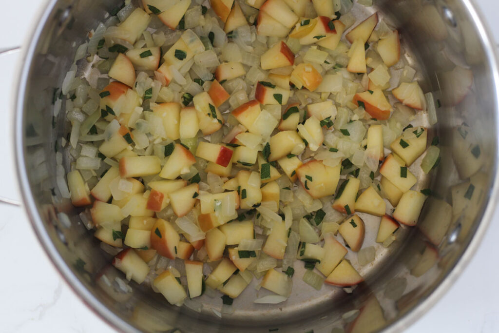 chopped apple, onion, sage, and garlic sautéing in stock pot