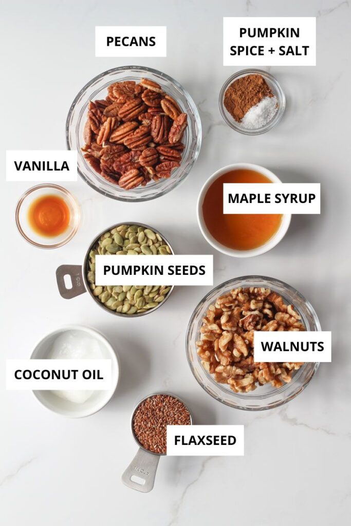 pumpkin seed granola ingredients on marble counter labeled