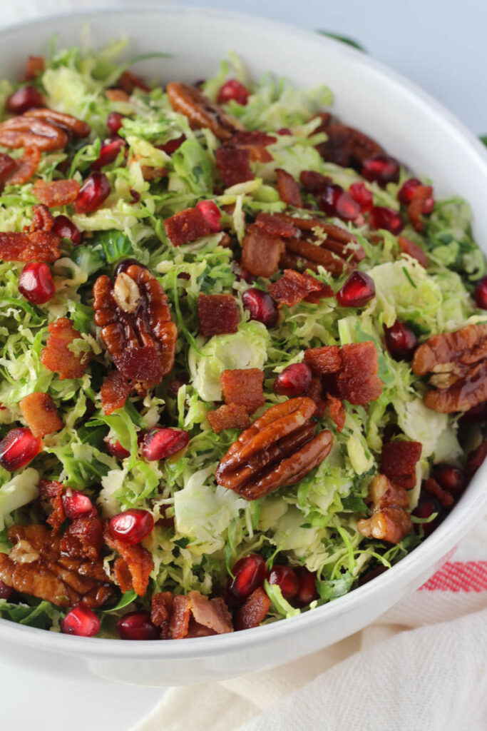 close up of Brussels sprouts salad in white bowl