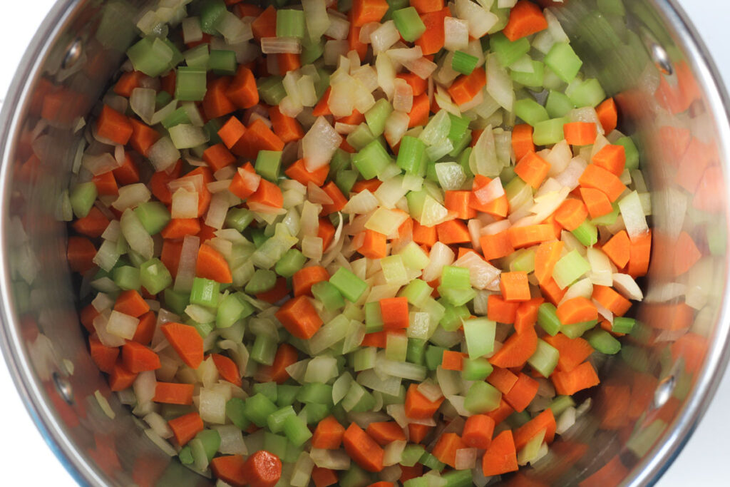 sautéing the onion, carrots, and celery in large stockot
